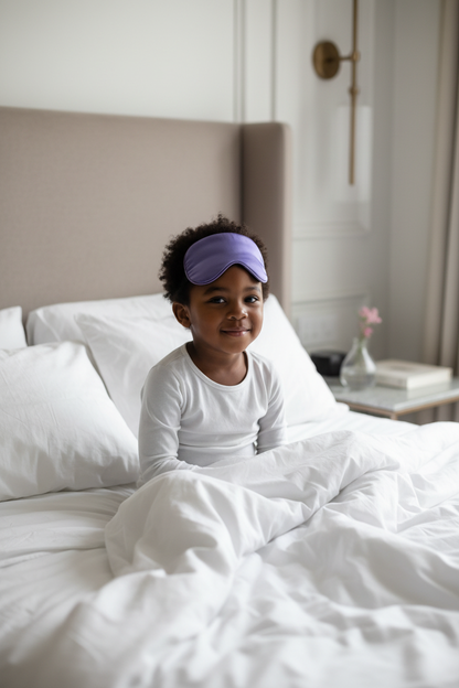 Child with Deep Purple Eye Mask on Forehead