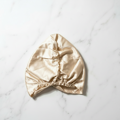 Cream bonnet — no florals, marble background